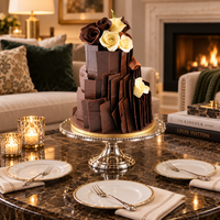 KimBeAu Chocolate Slab Three Tier Cake presented in an elegant living room setting with silver cake stand and cake plates.