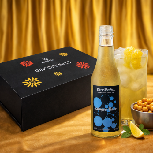 Buy Online KimBeAu Ginger Beer Still Non-Alcoholic Drink 250ml bottle with iced glass and lemon garnish on caramel silk background