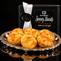 Luxury KimBeAu sauce and savoury biscuit gift box presented in premium black packaging.