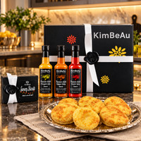 Luxury KimBeAu Hot and Spicy Gift Box featuring three Caribbean-inspired spicy sauces and savoury biscuits.