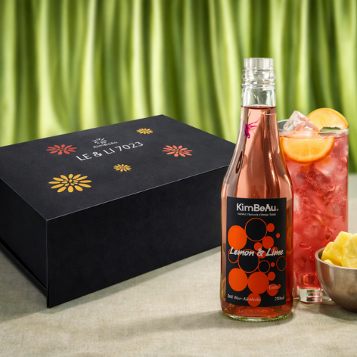 KimBeAu Lemon & Lime Still Non-Alcoholic Drink 250ml bottle with iced citrus glass on silk table setting