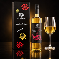KimBeAu Passion Fruit Blanc Wine served beside an elegant wine glass in a luxury black background setting.