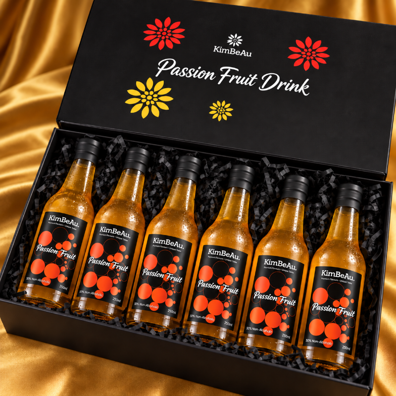 Premium KimBeAu Passion Fruit Drink gift set featuring six non-alcoholic bottles in an elegant black box.