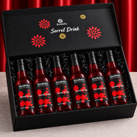 KimBeAu Sorrel Drink six bottle gift box with black caps and premium black shredded paper presentation.